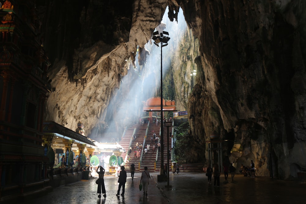 a group of people that are standing in a cave