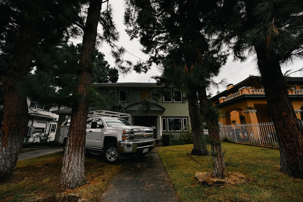 a truck is parked in front of a house