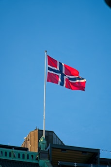a flag flying on top of a building