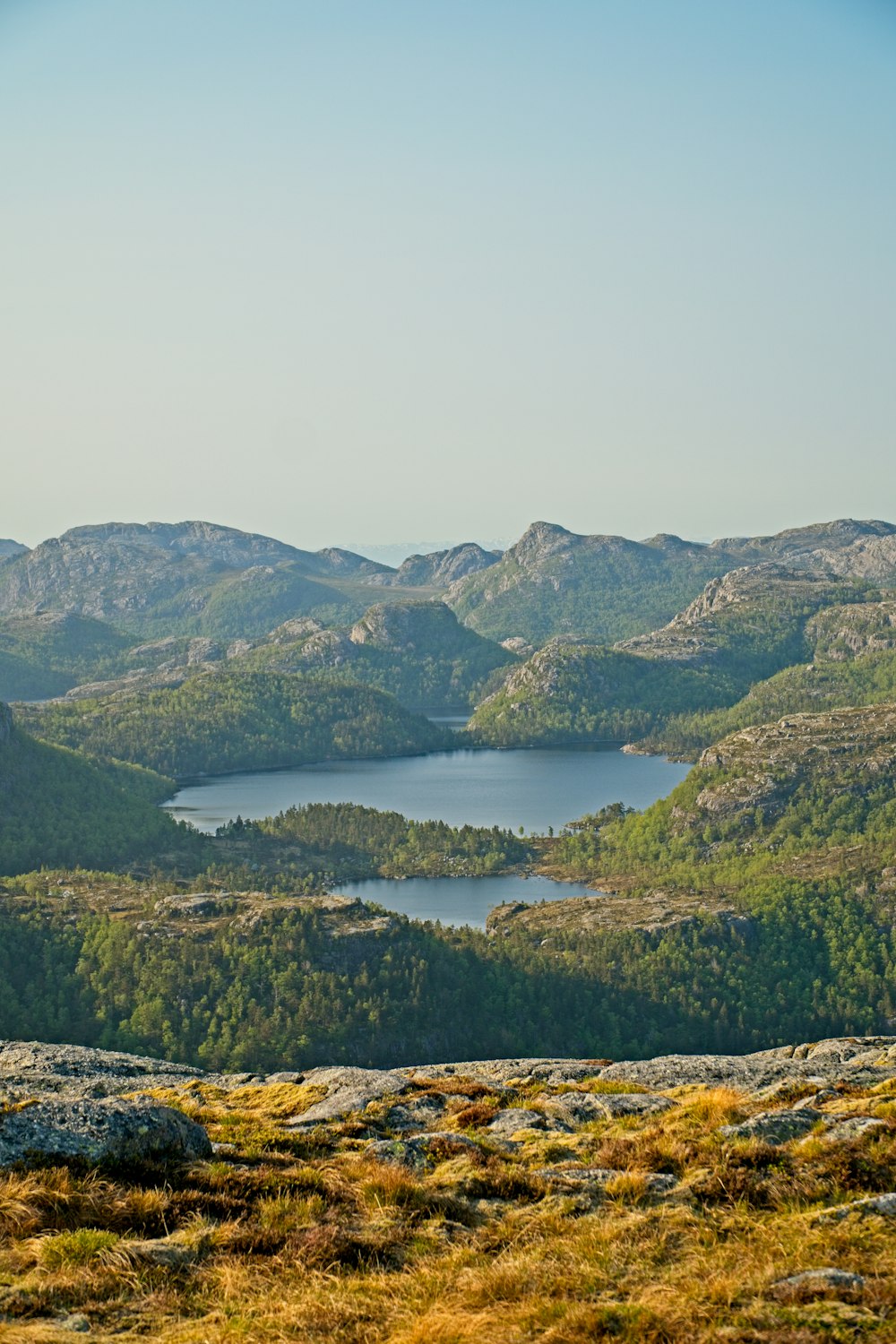 a view of a mountain range with a lake in the middle