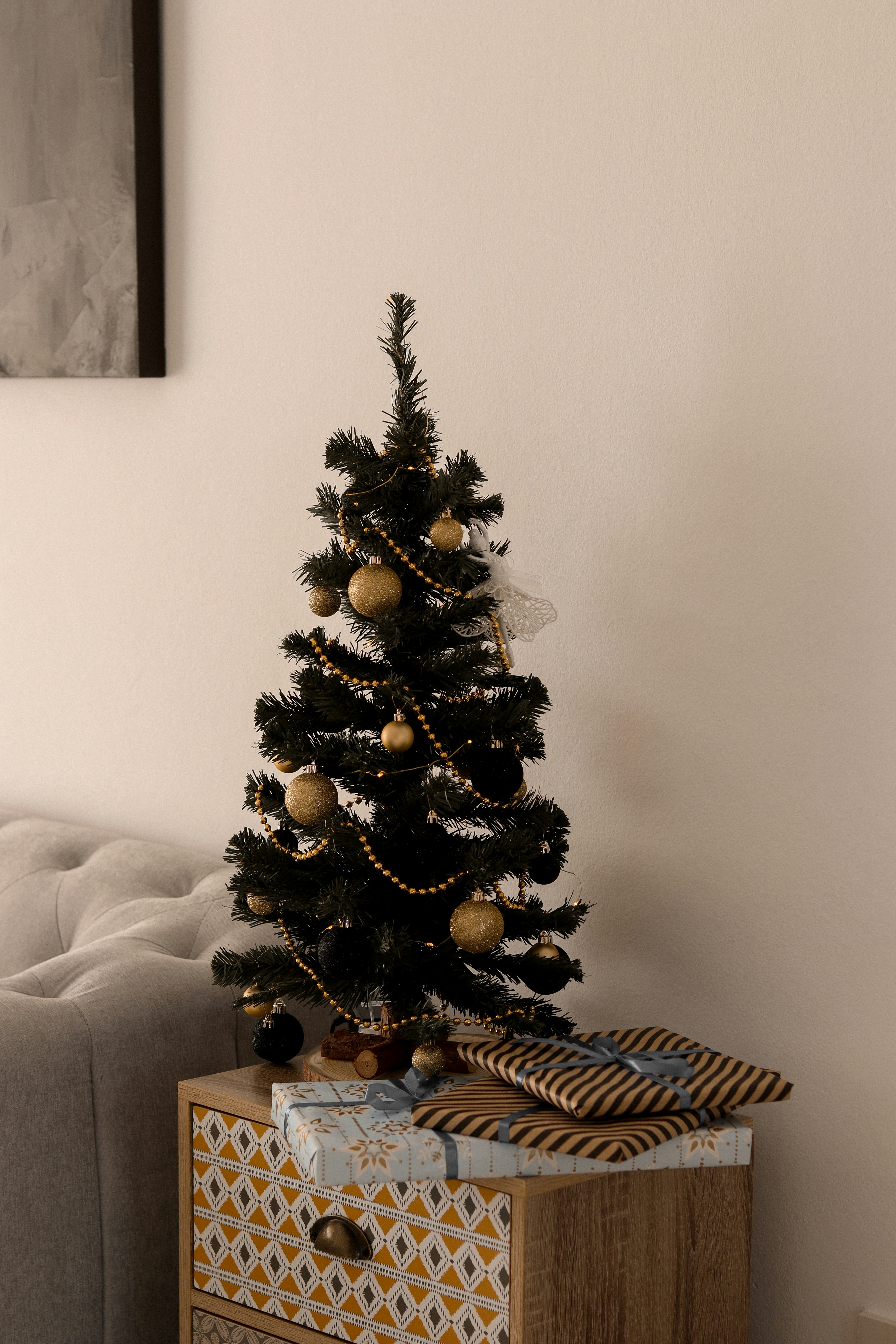 a small christmas tree sitting on top of a wooden box