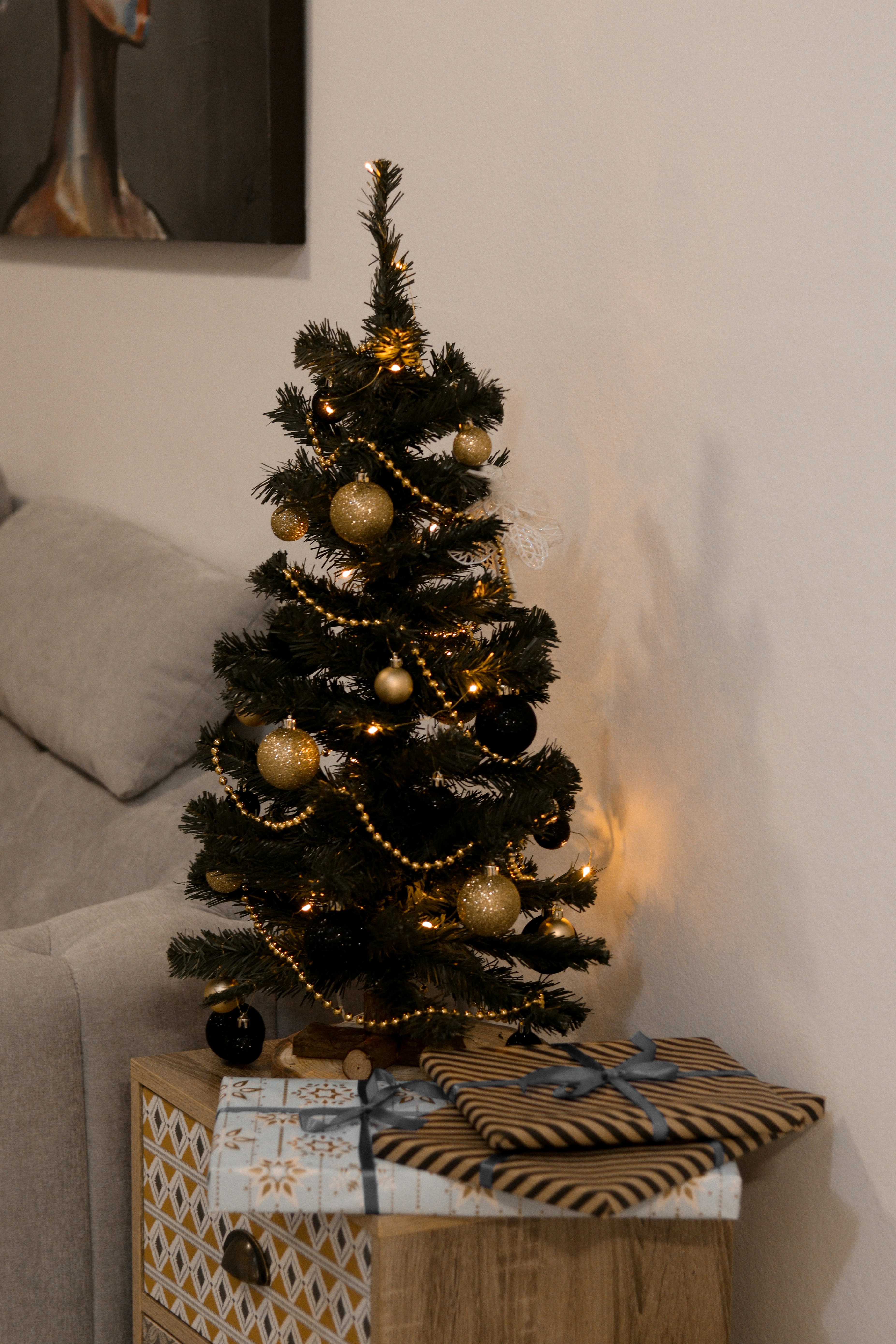 a small christmas tree sitting on top of a wooden box