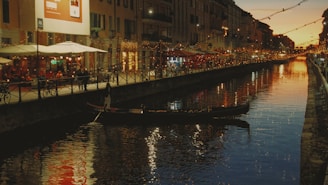 A lively gondola ride through the narrow canals of Venice at dusk.