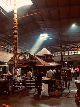 Sunlight streaming through temple pillars in early morning.