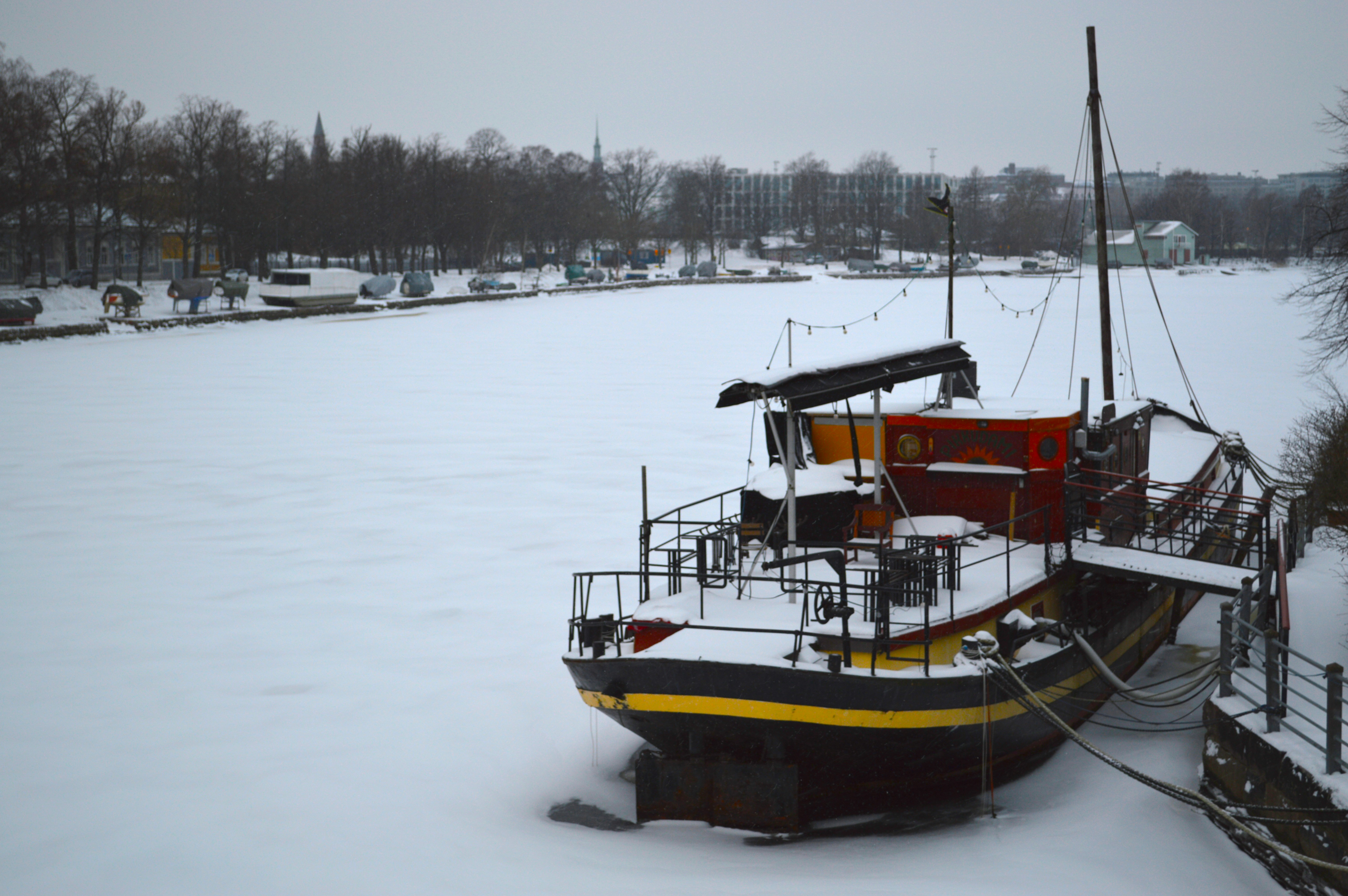 A boat being winterized in a storage yard