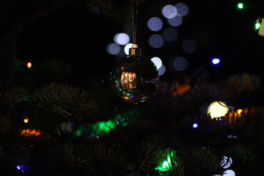 a close up of a christmas ornament on a tree