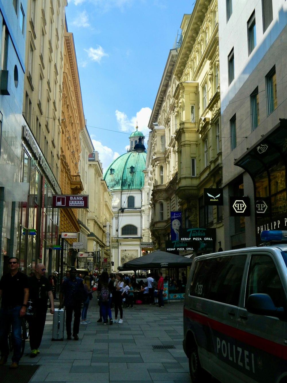 a busy city street with people walking around