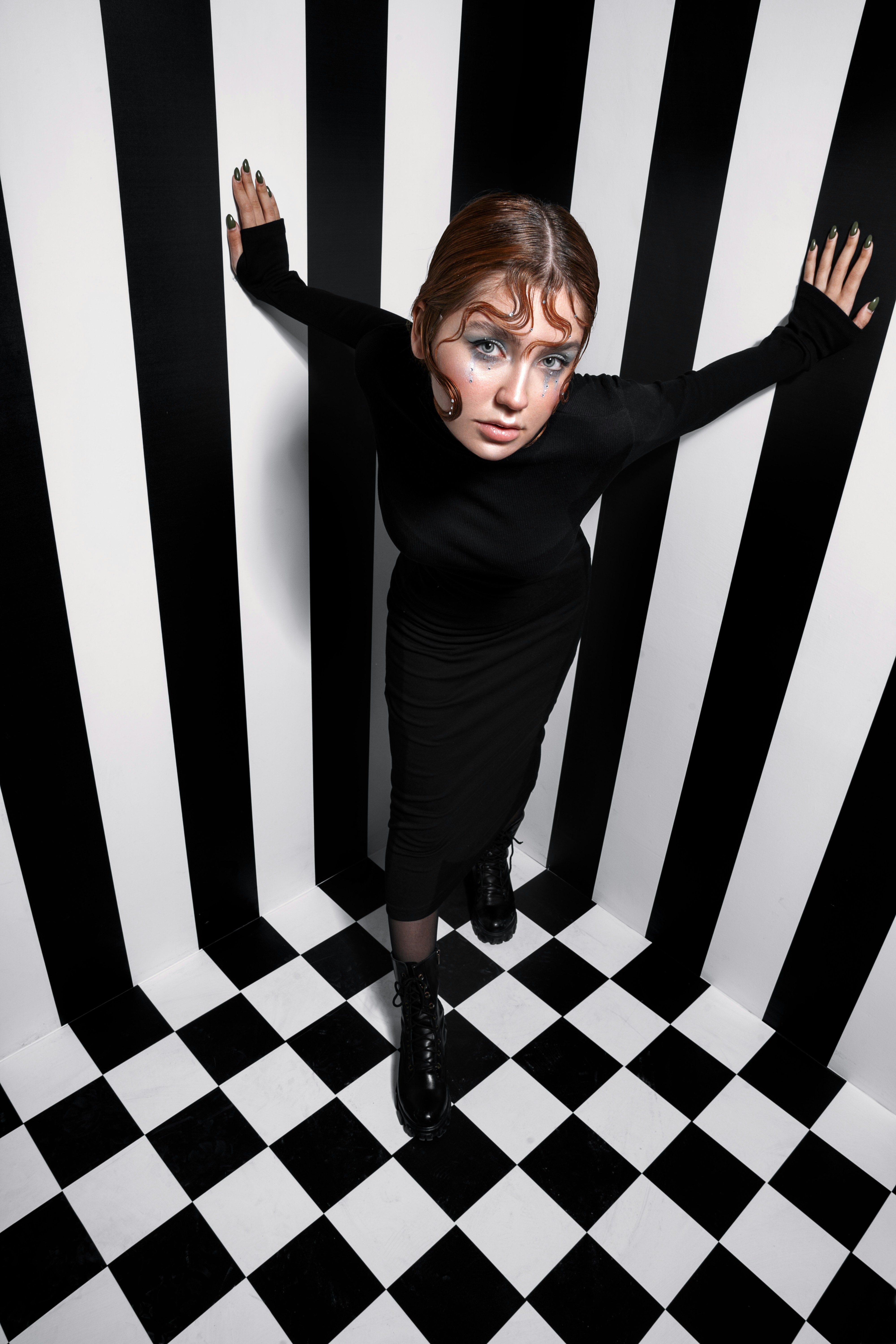 a woman in a black and white striped room