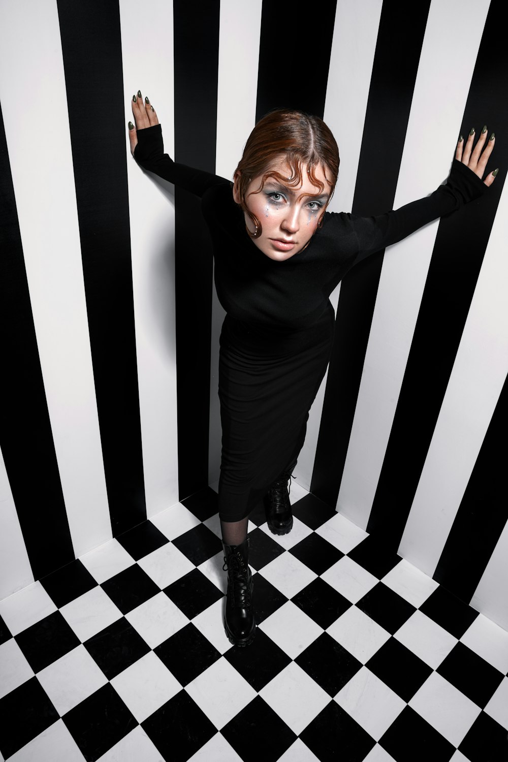 a woman in a black and white striped room