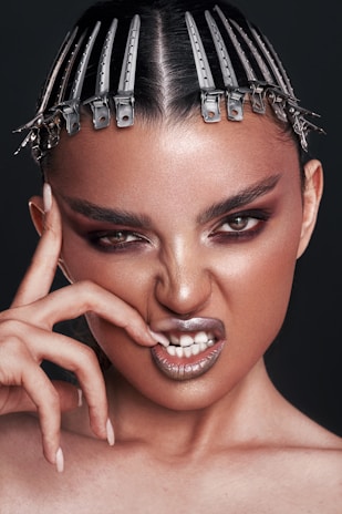 a woman with metal hair clips on her head