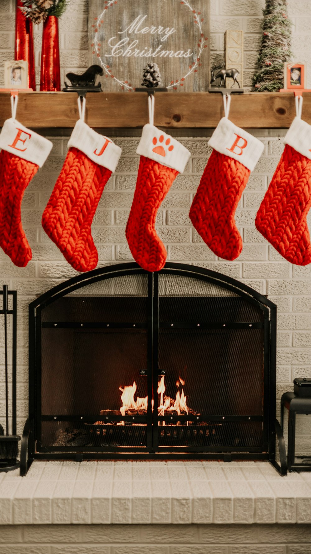 a fireplace with stockings hanging over it