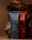 Two toothpaste tubes are positioned against a backdrop of textured, bark-like material. The tube in the foreground is blue and prominently displays the brand name 'before' and the text 'Whitening.' The tube behind it is red with similar branding.