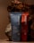 Two toothpaste tubes are positioned against a backdrop of textured, bark-like material. The tube in the foreground is blue and prominently displays the brand name 'before' and the text 'Whitening.' The tube behind it is red with similar branding.