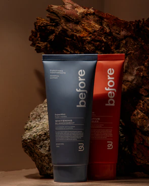 Before and after side-by-side photos showing teeth whitening progress.