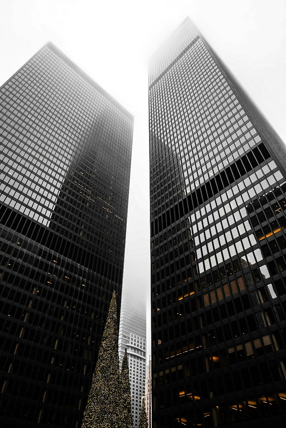 a couple of tall buildings sitting next to each other