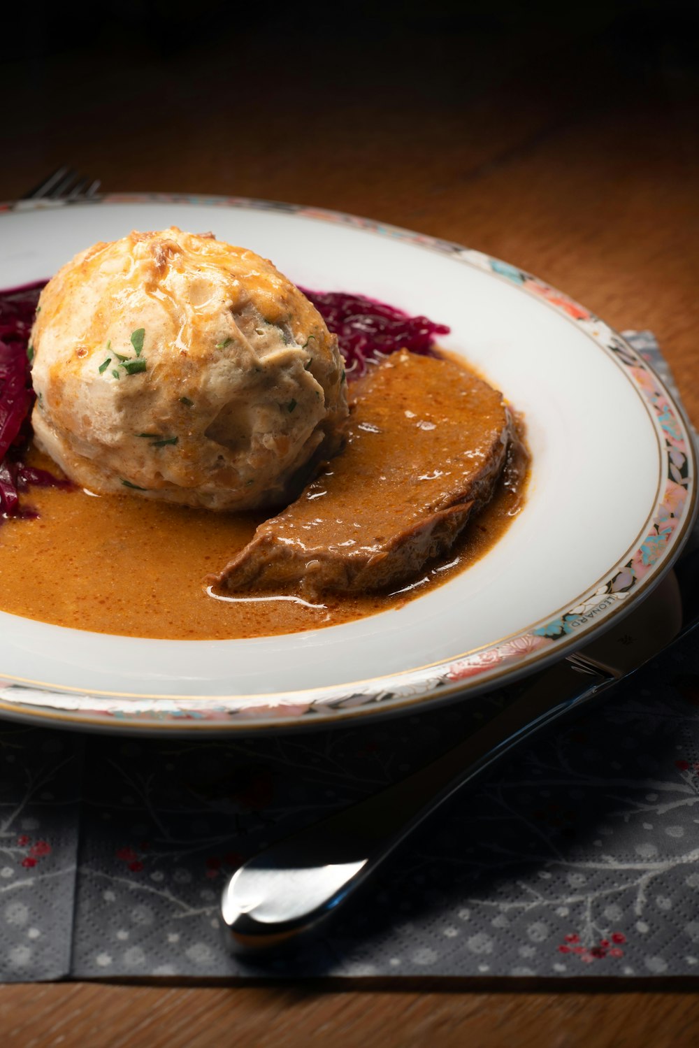 a plate of food on a wooden table