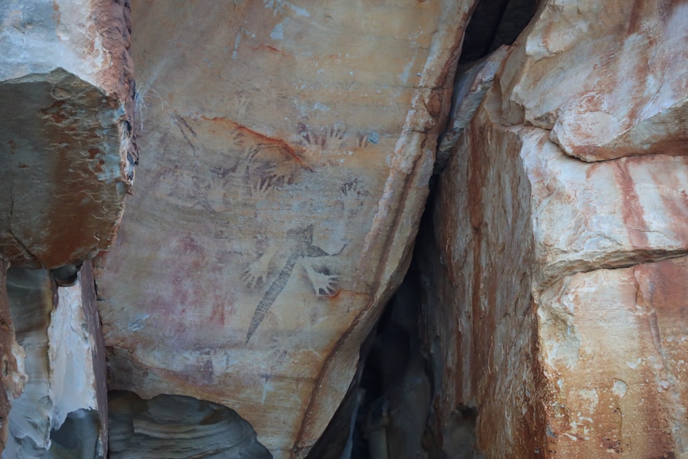 a large rock with some paintings on it