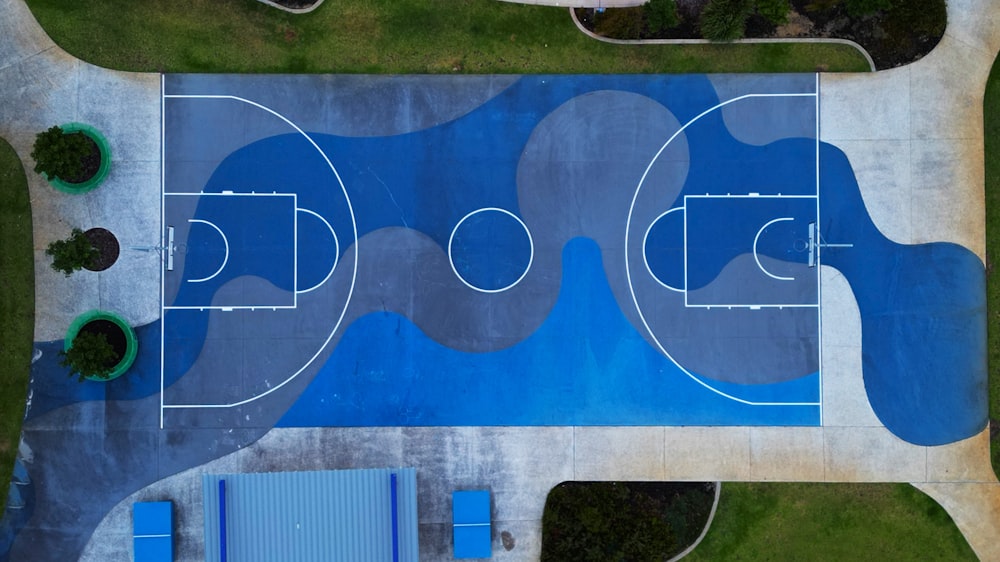 an aerial view of a basketball court in a park