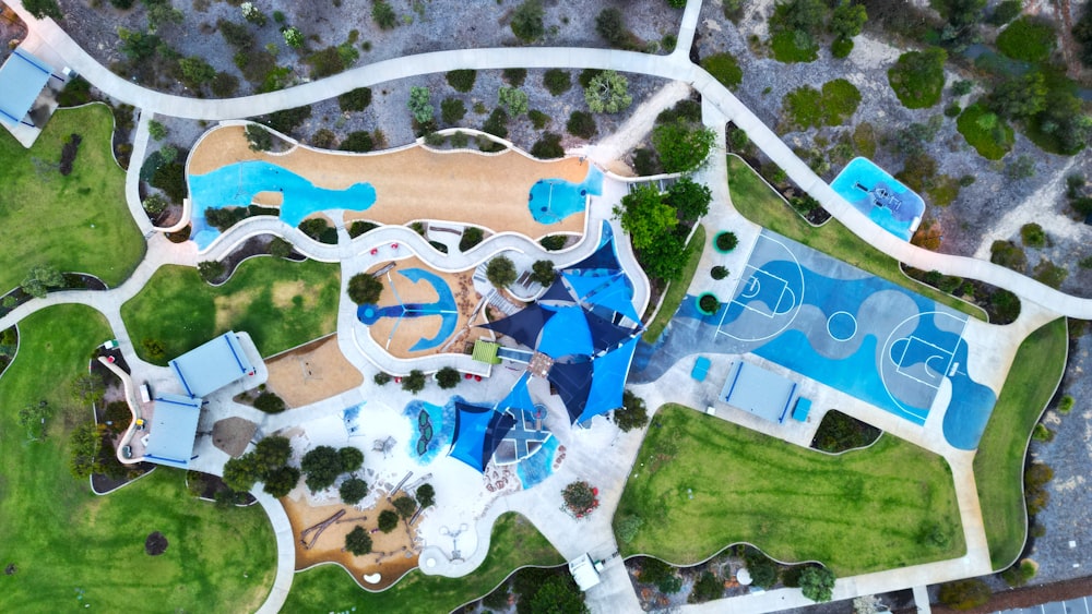 an aerial view of a park with a swimming pool