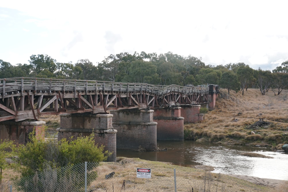 a train crossing a bridge over a river