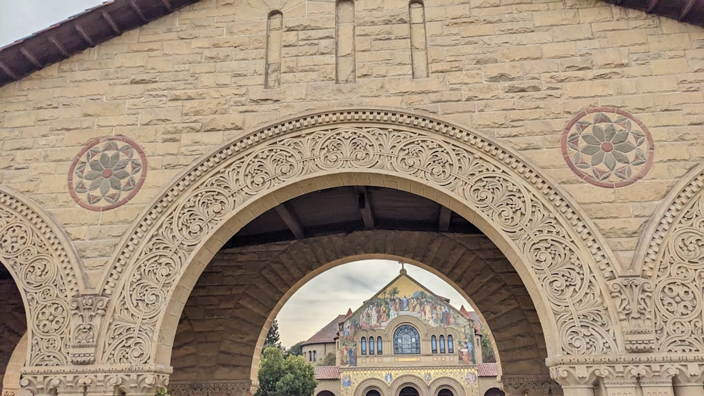 a large stone building with a clock on it's side