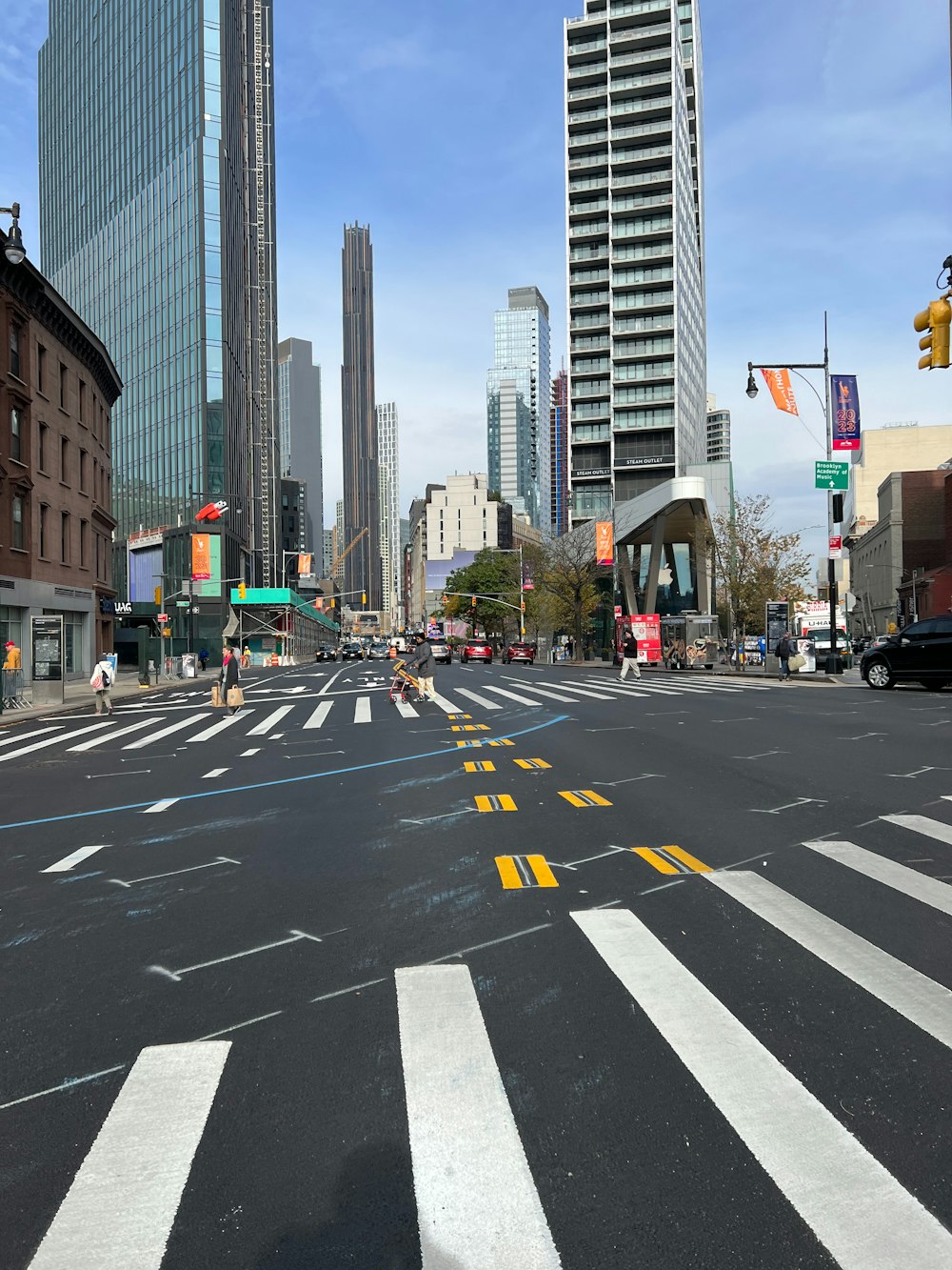 a city street with a lot of tall buildings