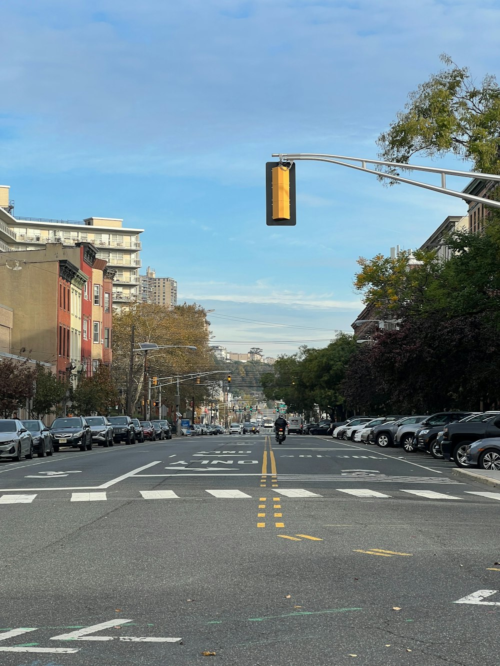 a traffic light hanging over a city street