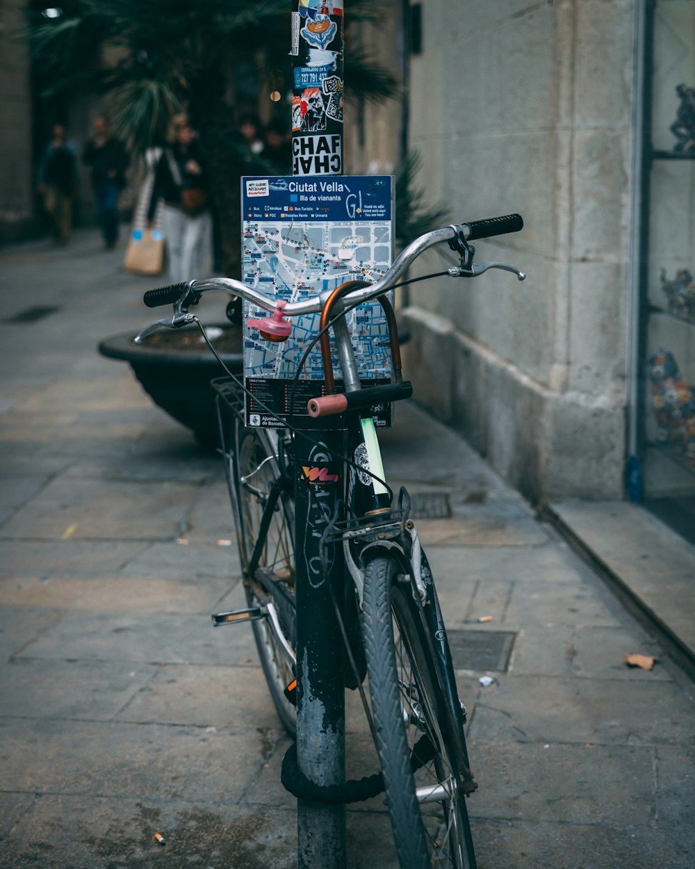 a bicycle parked on the side of a street