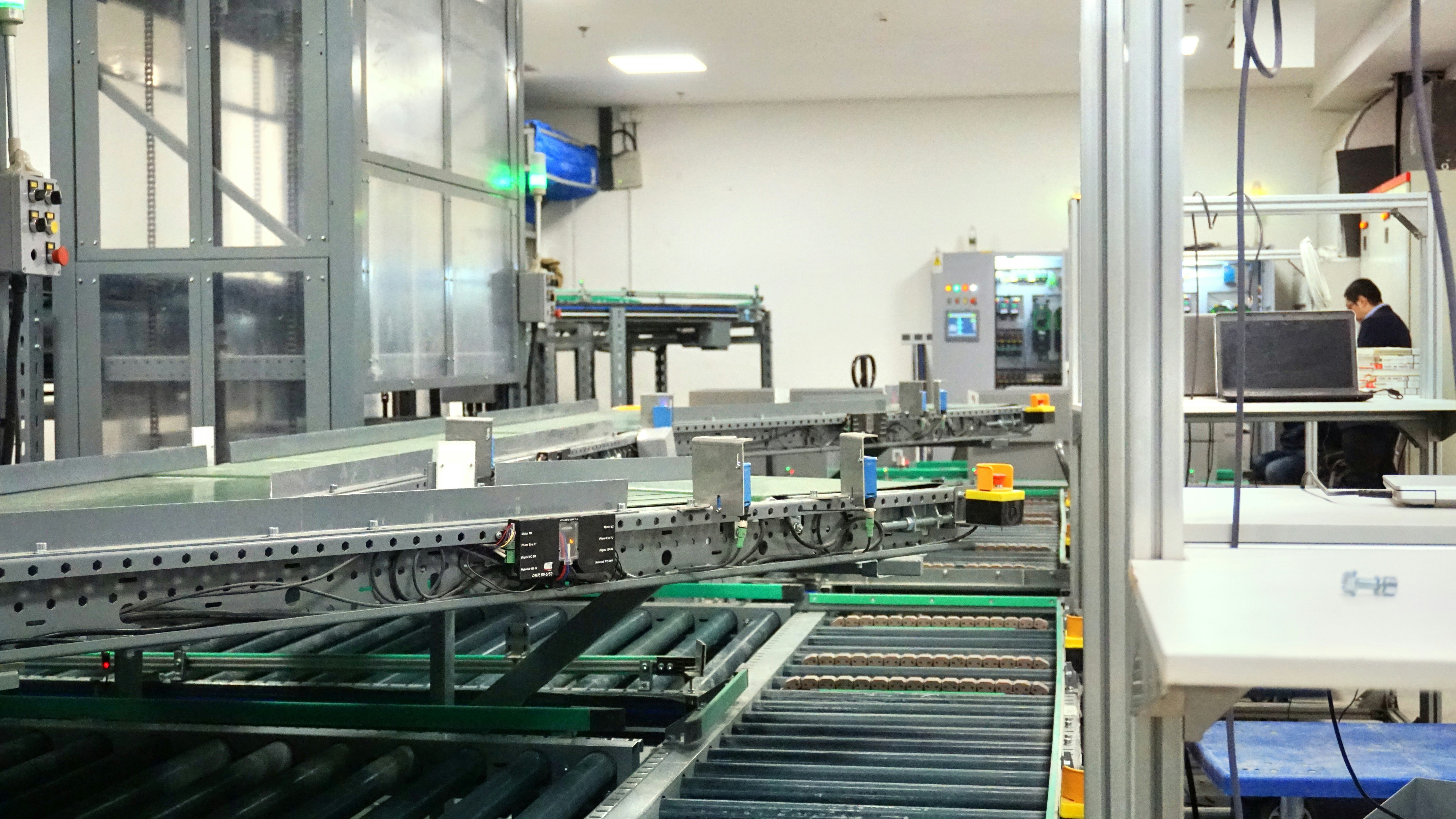 Modern manufacturing facility with organized waste management systems and recycling stations