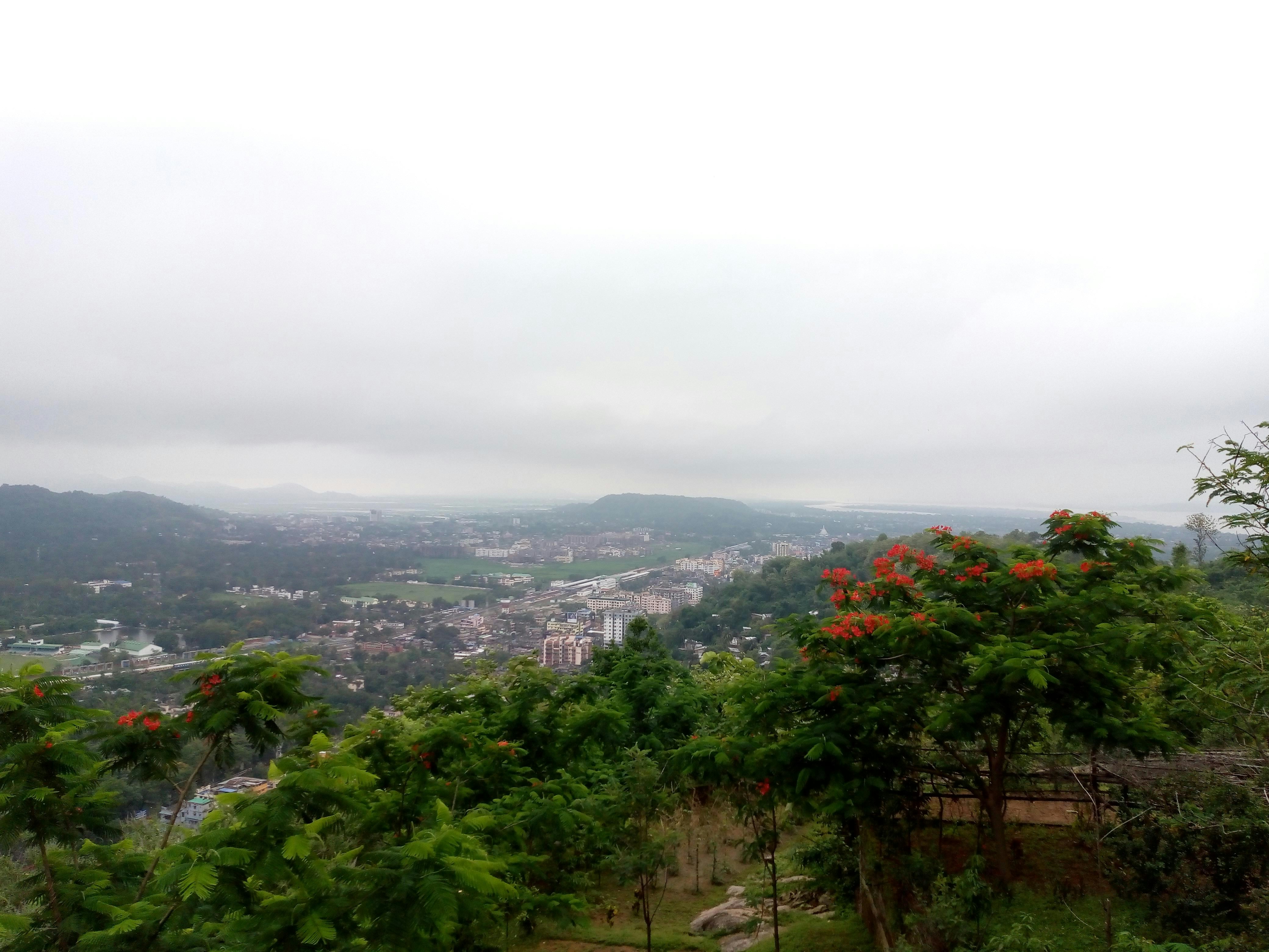 A panoramic shot of a hillside resort with blooming flowers in Da Lat