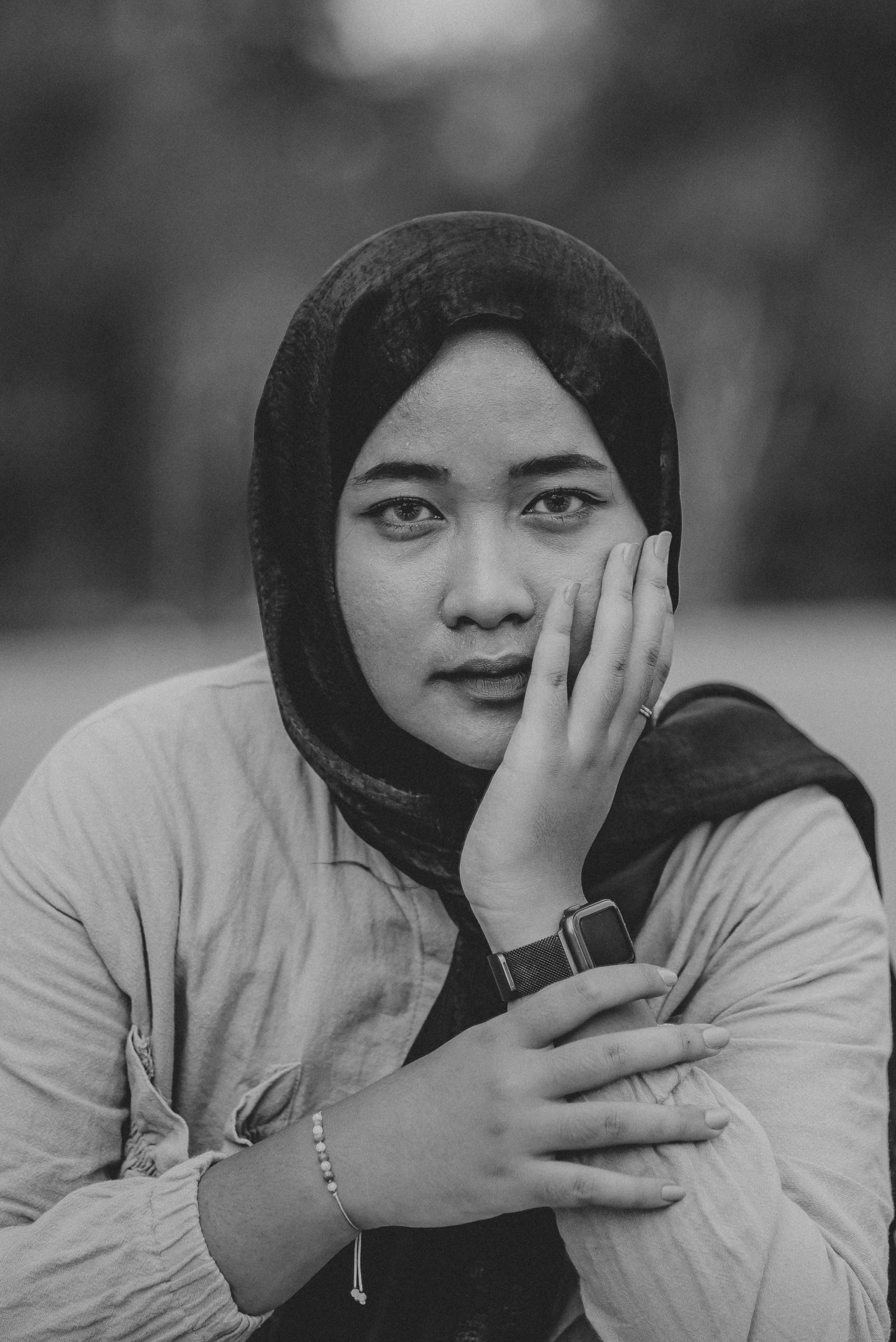A black and white photo of a woman with a hood on photo – Free Portrait ...