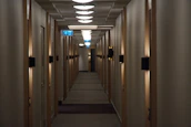 Close-up of saferoom travel™ device scanning a hotel room with a calm, focused ambiance.