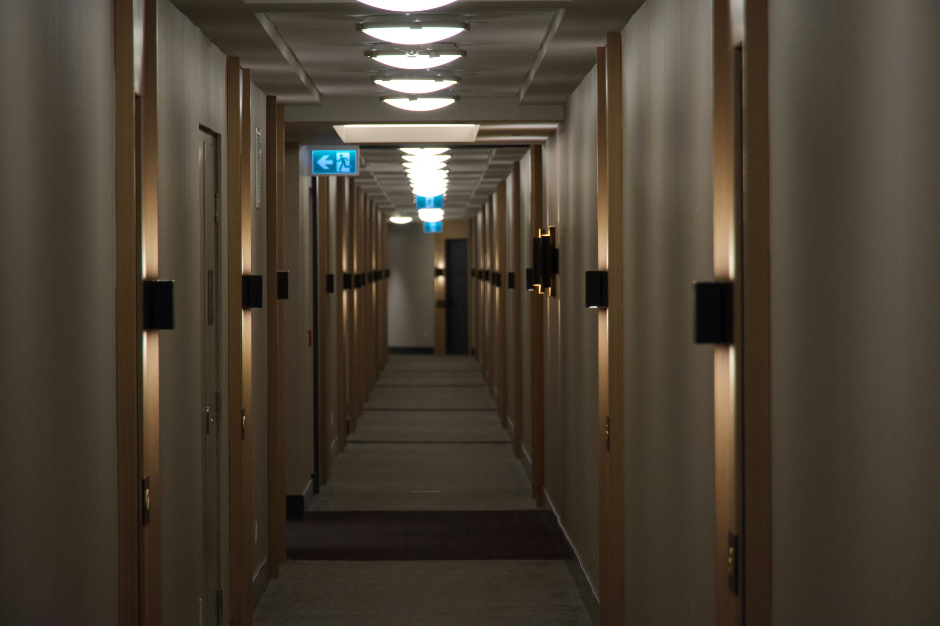 woman wearing yellow long-sleeved dress under white clouds and blue sky during daytime