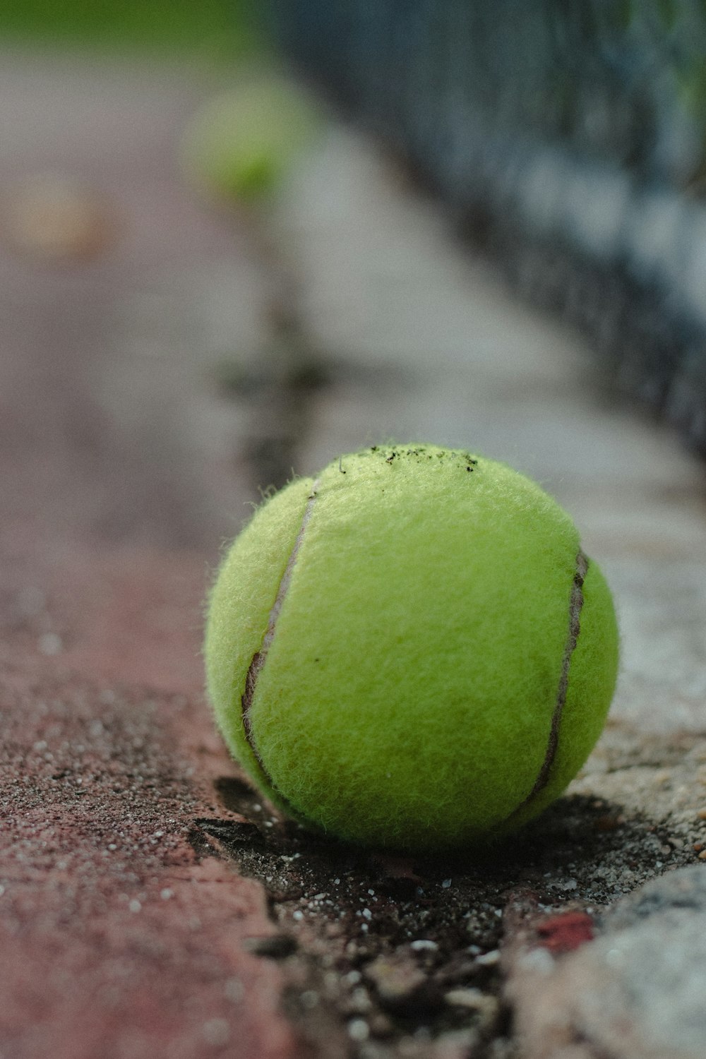 a tennis ball is laying on the ground