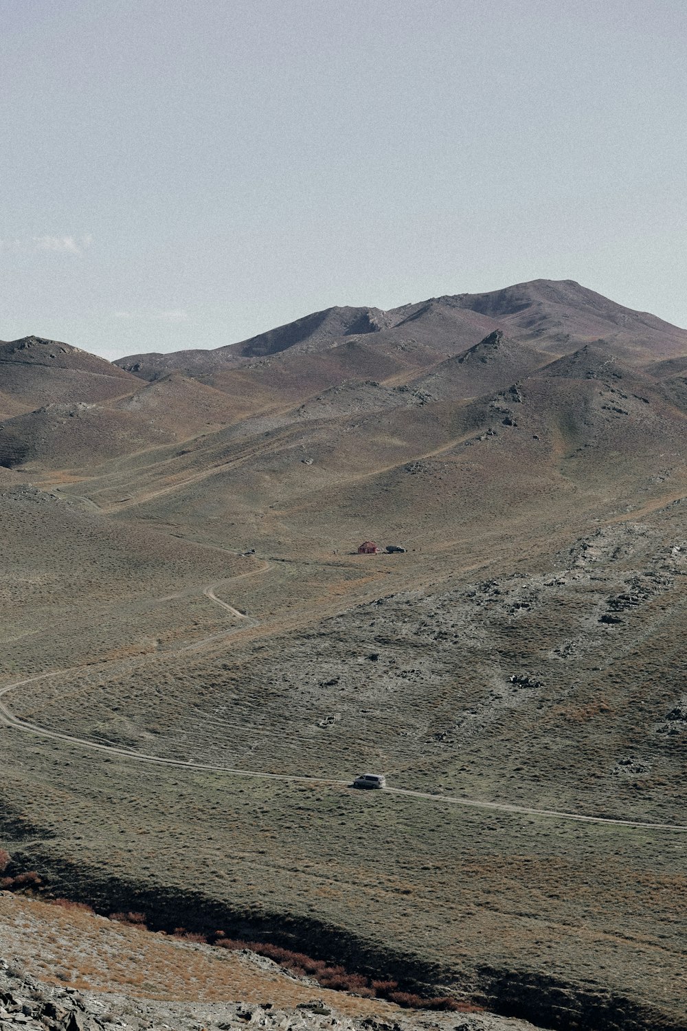 a mountain range with a road going through it