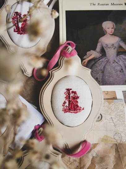 Close-up of a delicate 1950s miniature painting framed in vintage wood.