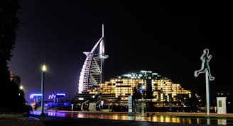 a night view of a city with tall buildings