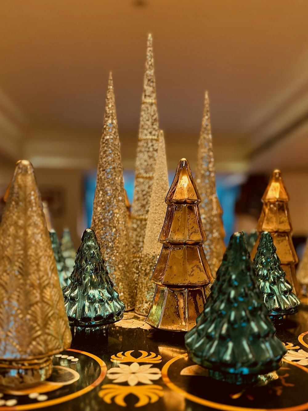 a group of glass trees sitting on top of a table