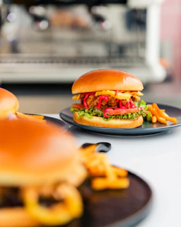 Close-up of a crispy, golden chicken burger with fresh lettuce on a wooden table