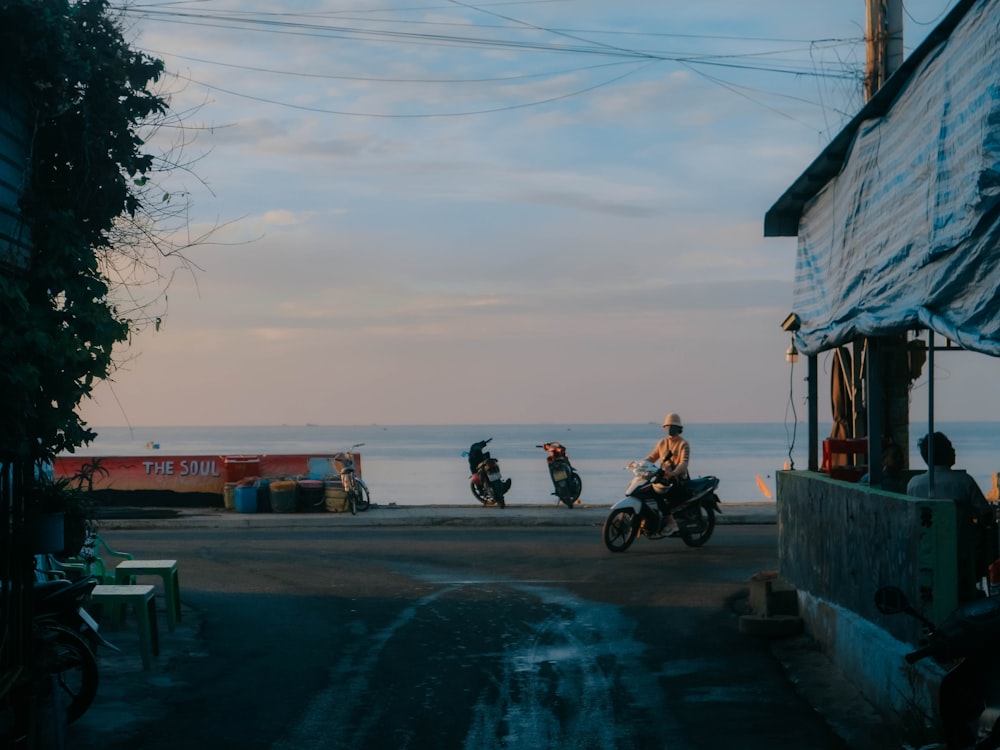 a group of people riding motorcycles down a street