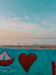 A serene beach at sunset, symbolizing love and redemption.