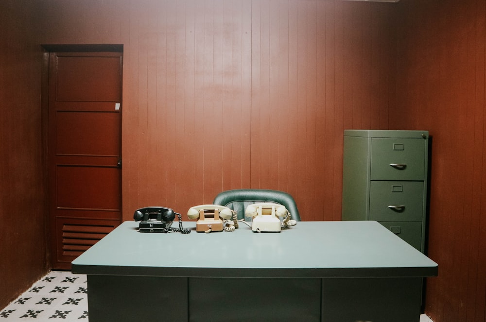 a room with a desk and a filing cabinet