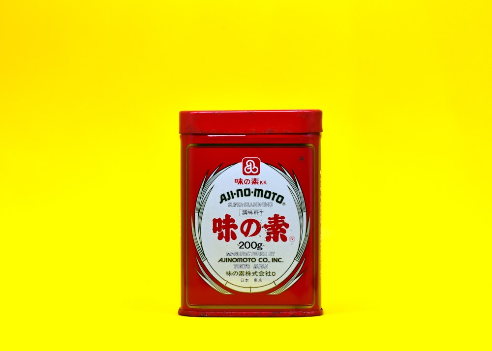 a tin of food on a yellow background