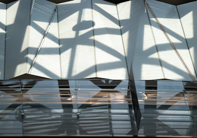 Artistic shot of the workshop's glass surfaces with reflections and shadows