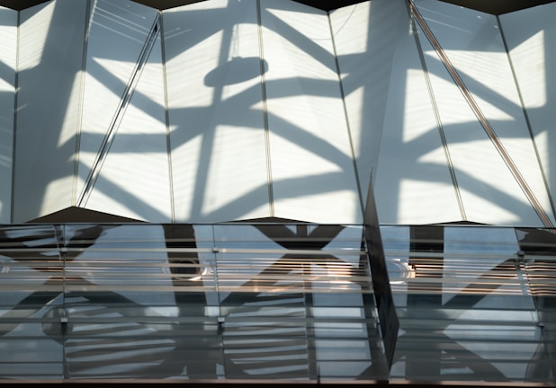 Abstract shadows dancing on textured walls, inspired by ambient melodies.