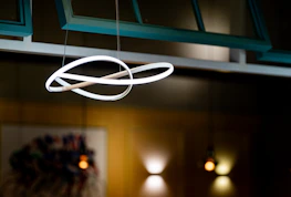 a circular light fixture hanging from a ceiling