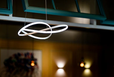 a circular light fixture hanging from a ceiling