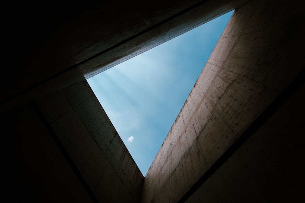 a view of the sky through a window in a building