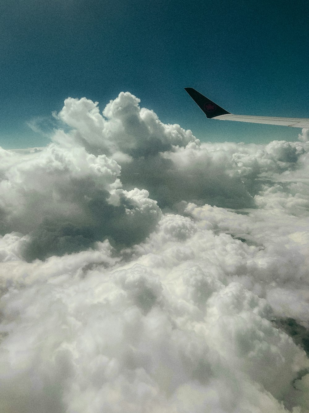 a view of the wing of an airplane in the sky