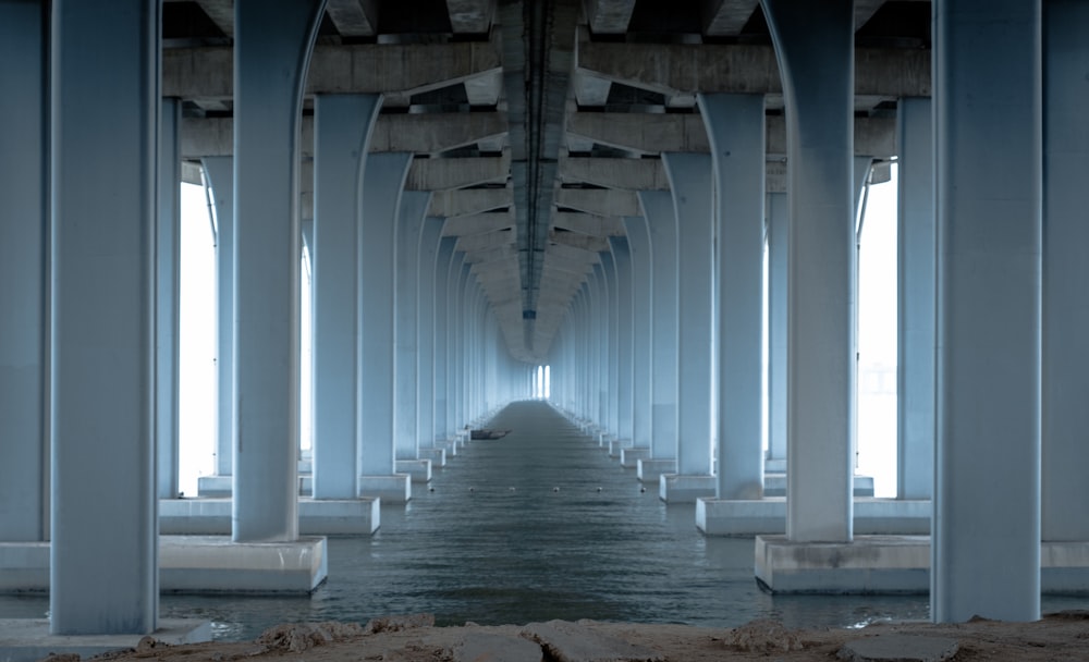 a view of a very long bridge from the water